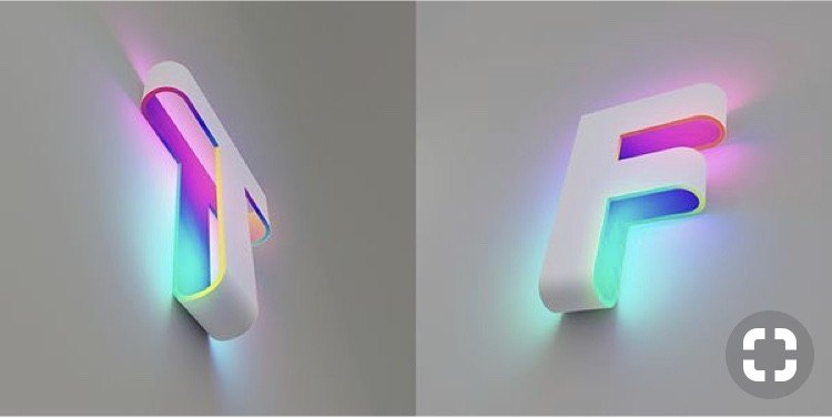 Colour-changing RGB illuminated letters mounted on a pale wall
