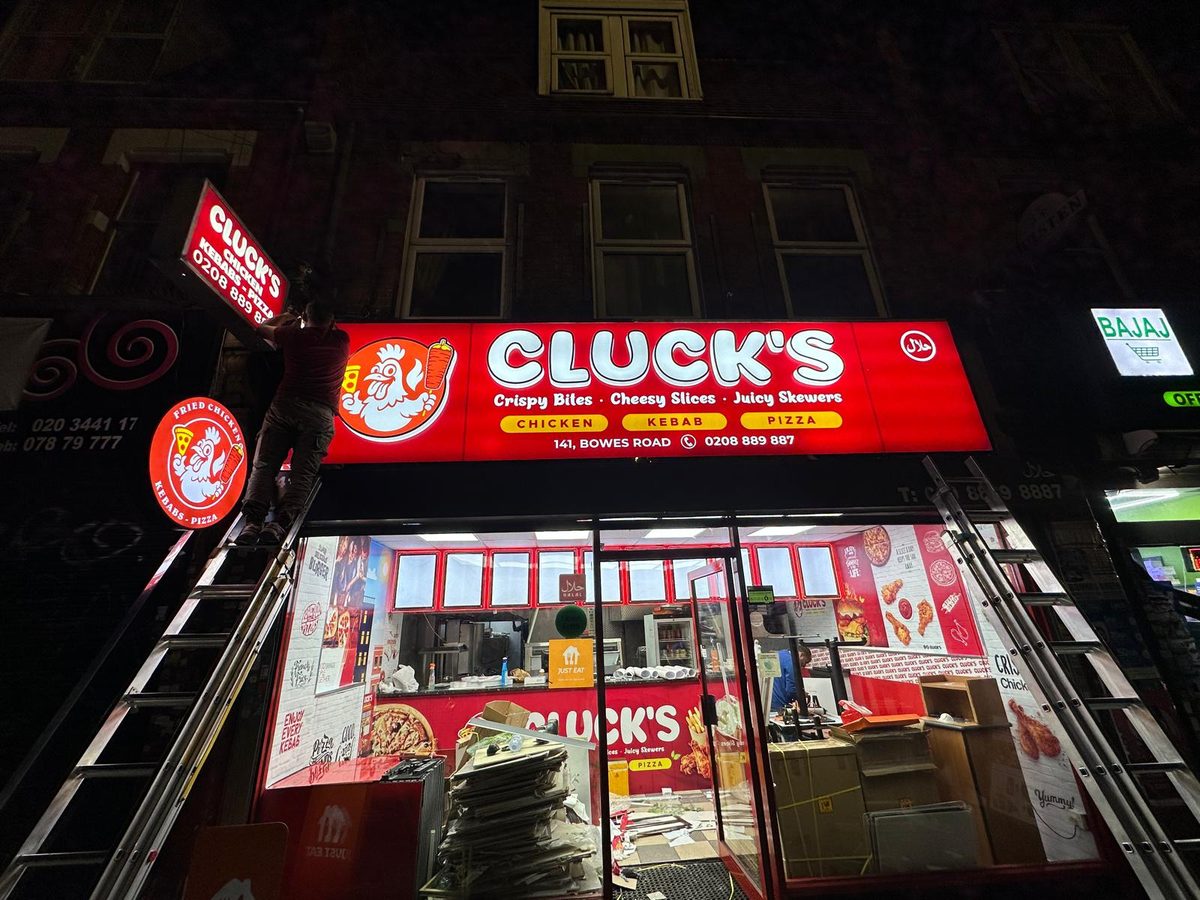 Cluck's shopfront sign made and fitted by Sign & Print