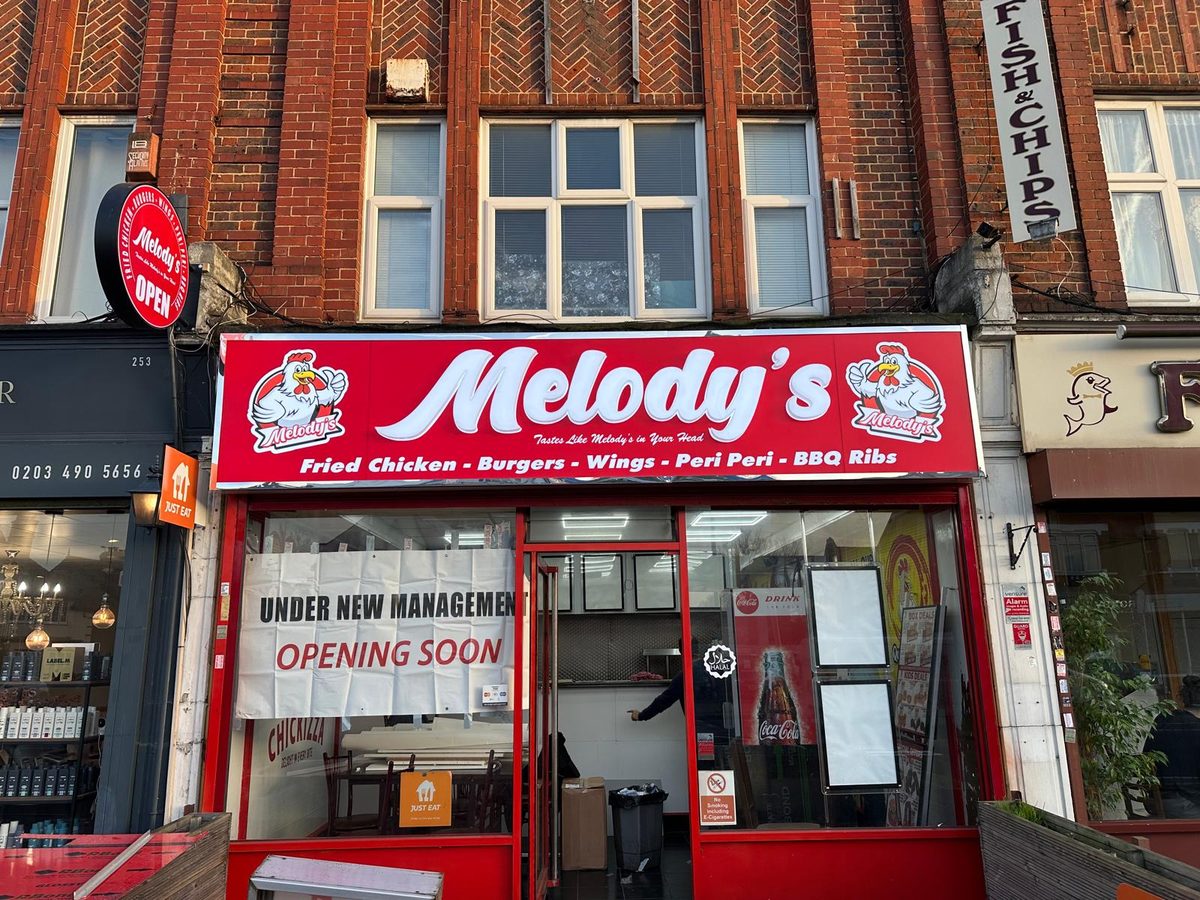 Melody's shopfront sign made and fitted by Sign & Print