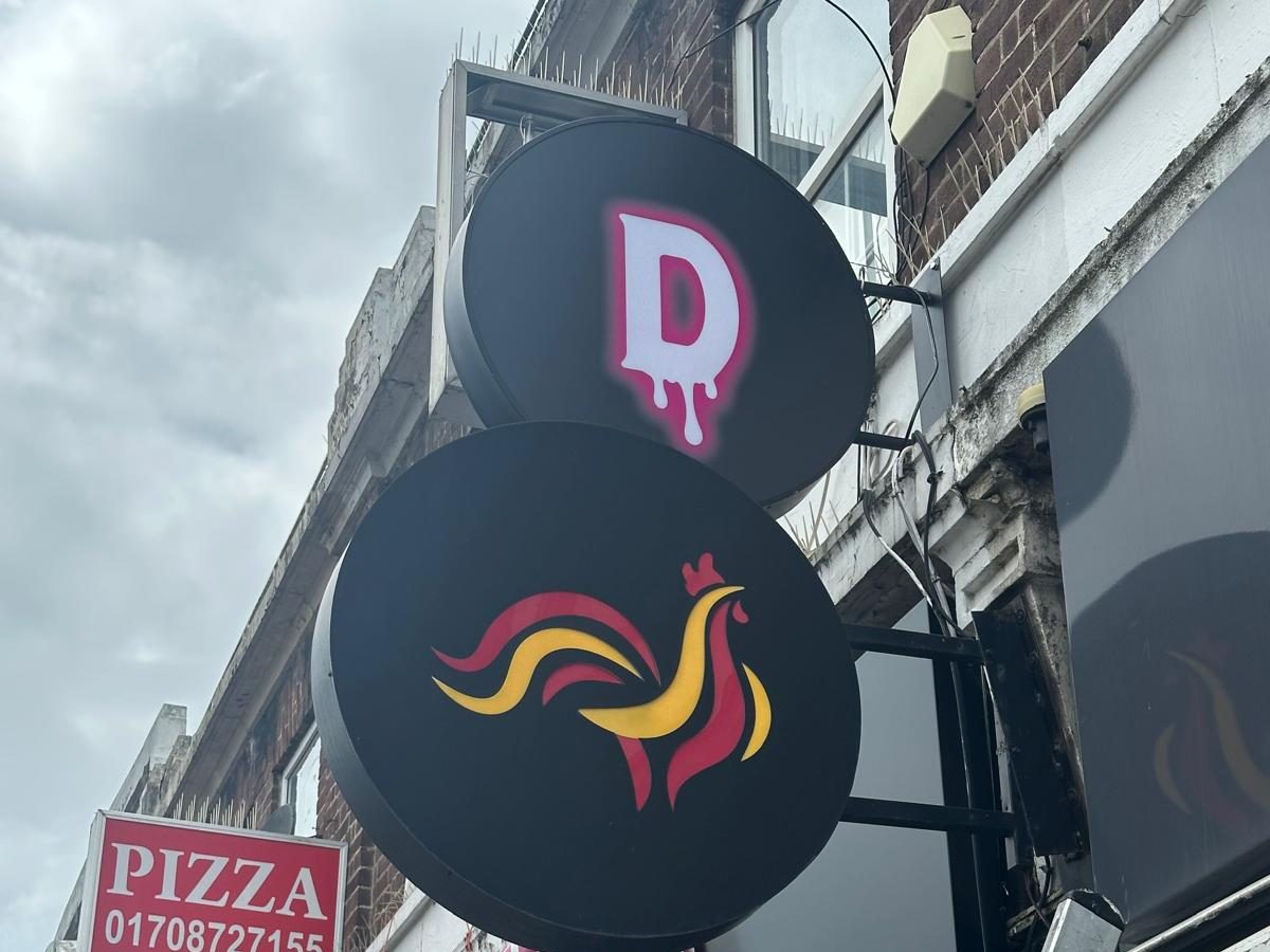 Projecting discs shopfront sign made and fitted by Sign & Print